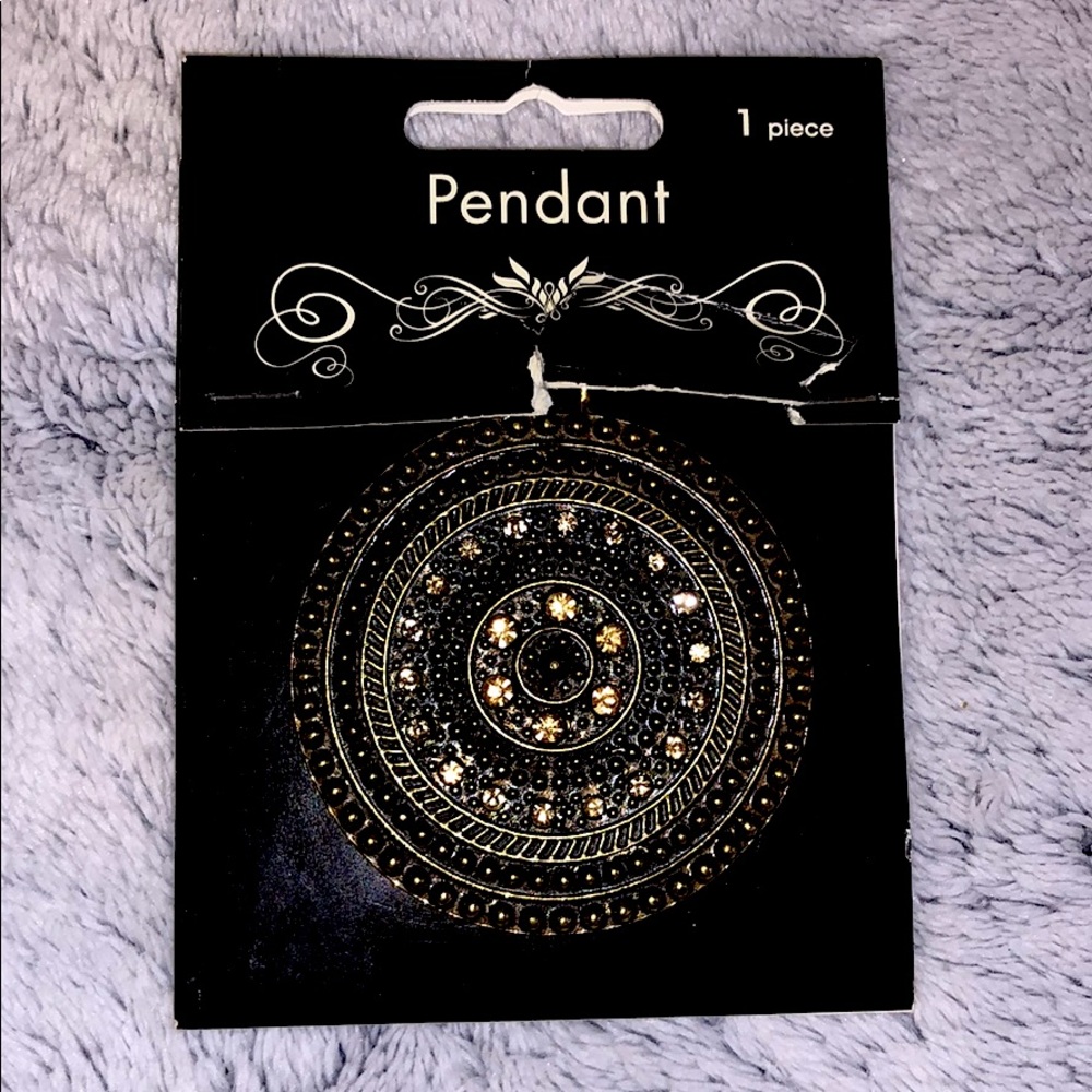 Gold and black pendant, black necklace included